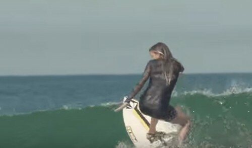 Woman Surfs In High Heels And It’s Totally Badass